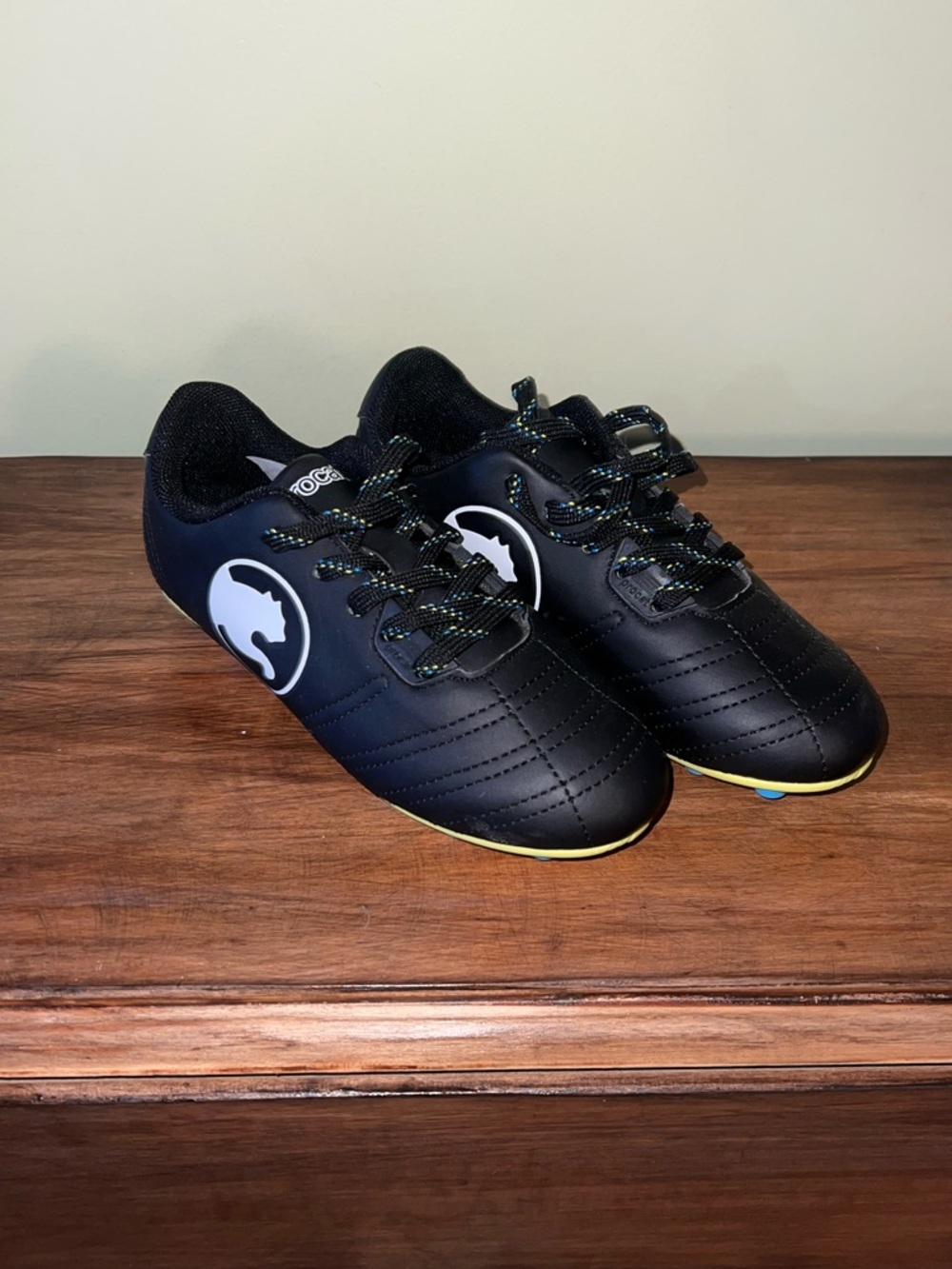 Kids Black Soccer Cleats with Yellow Trim